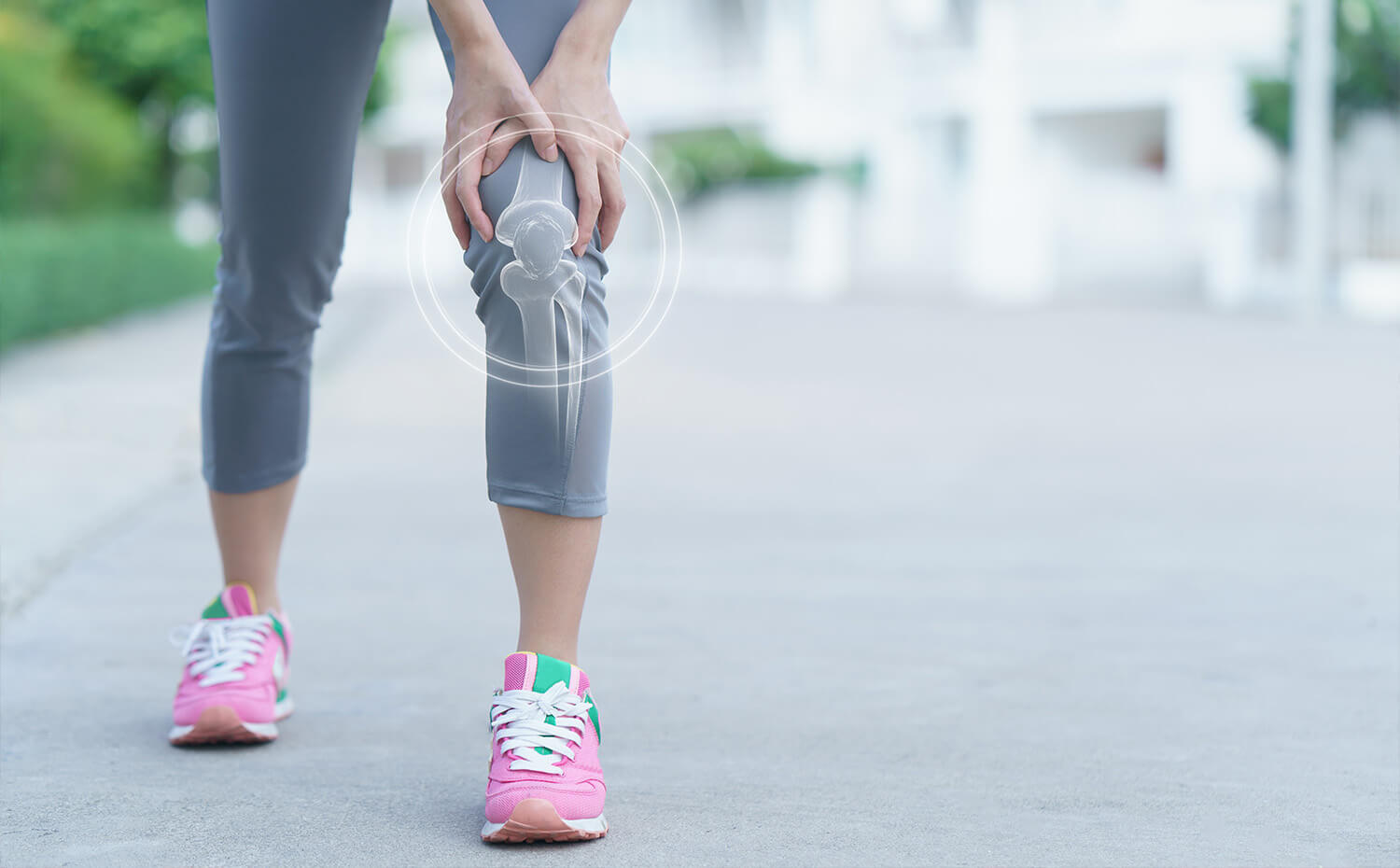 A person holding there knee in pain during exercise.